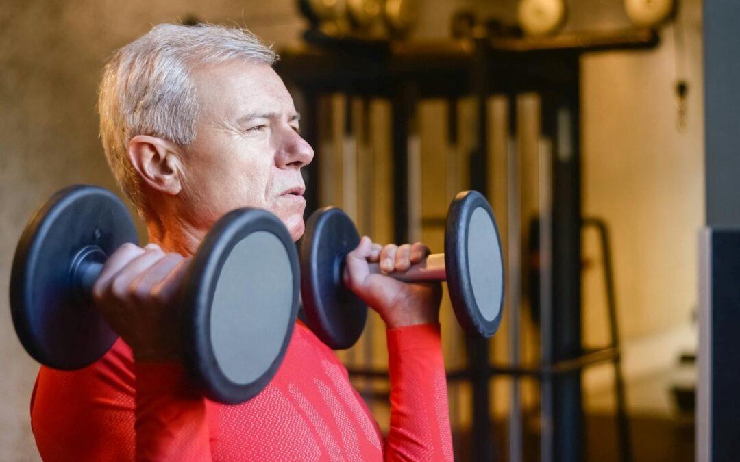 Elderly man lifting dumbbells