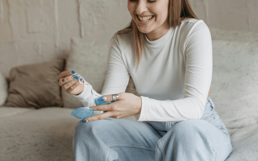 Smiling woman using a home health testing kit, emphasizing convenience and accessibility for wellness monitoring.